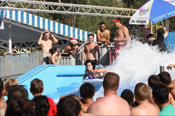 Katy Perry talks with a group of her friends after spending the afternoon at Raging Waters in San Dimas, California on August 12, 2012