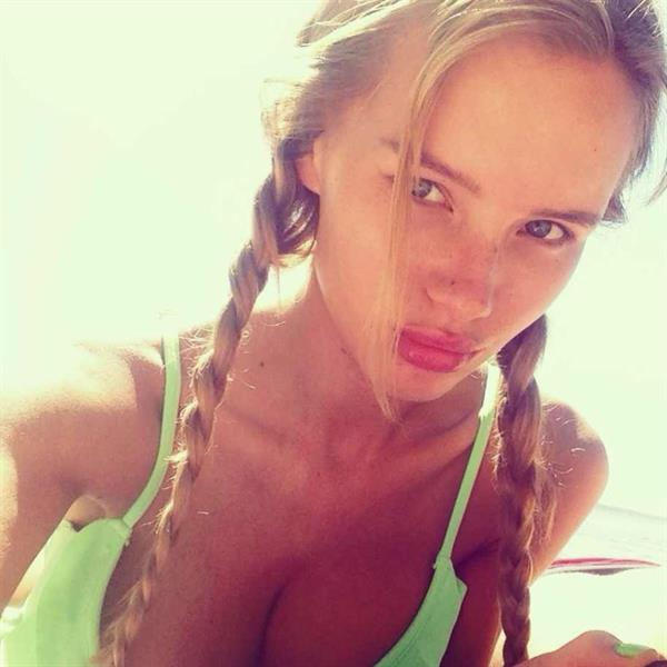 Olya Abramovich in a bikini taking a selfie