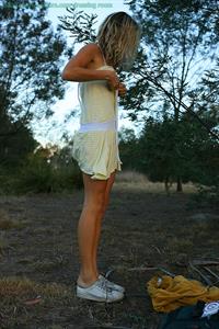 Johanna stripping down outside