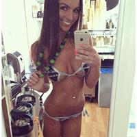 Carlie Jo in a bikini taking a selfie