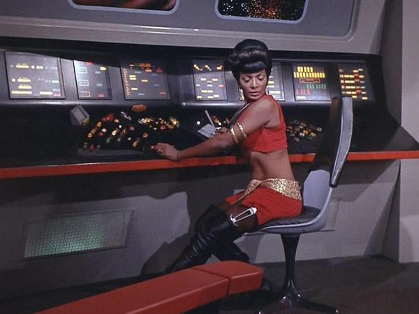 Nichelle Nichols as Lt. Uhura wearing something skimpy on the Star Trek Bridge
