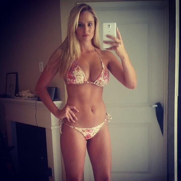 Genevieve Morton in a bikini taking a selfie