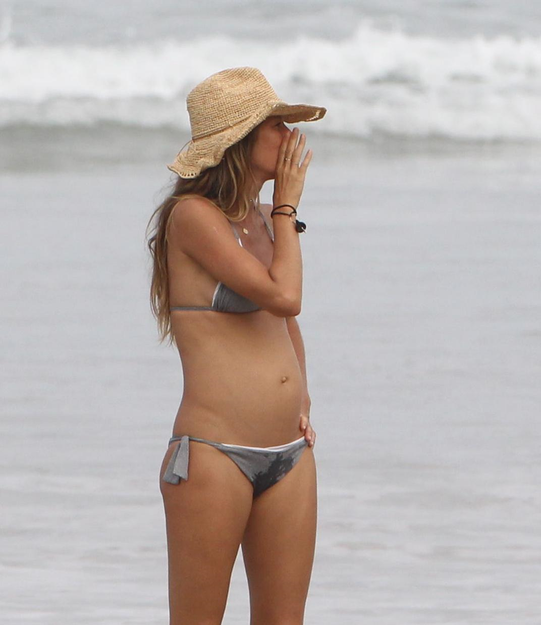 A pregnant Gisele Bundchen walking on the beach in Costa Rica - July 23, 20...