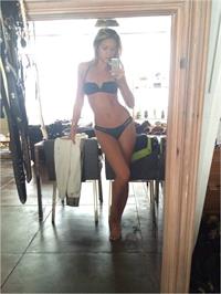 Jessie Andrews in a bikini taking a selfie