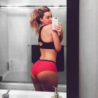 Emily Sears in a bikini taking a selfie