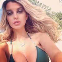 Emily Sears in a bikini taking a selfie