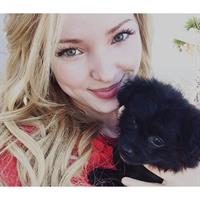Dove Cameron taking a selfie