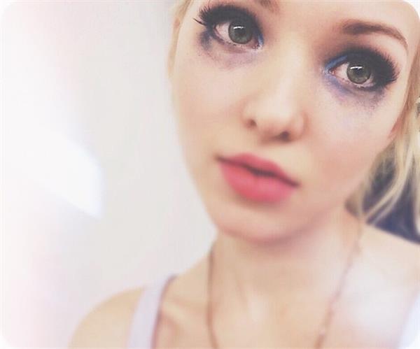 Dove Cameron taking a selfie