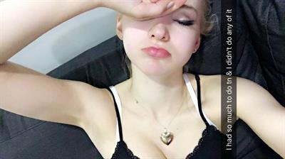 Dove Cameron taking a selfie