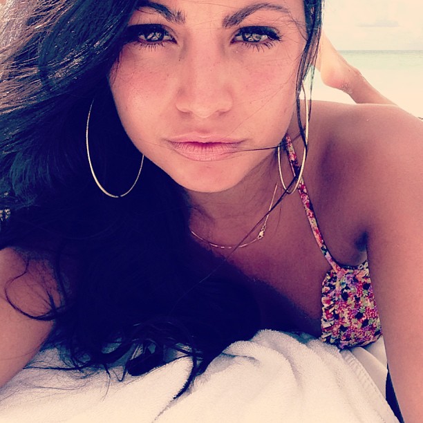 Mónica Alvarez in a bikini taking a selfie