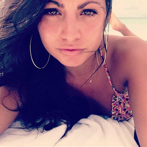 Mónica Alvarez in a bikini taking a selfie