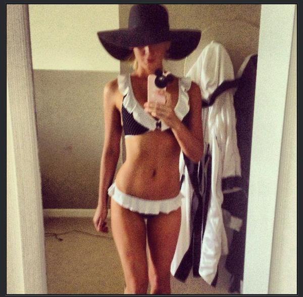 Sheridyn Fisher in a bikini taking a selfie