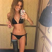 Paola Antonini in a bikini taking a selfie