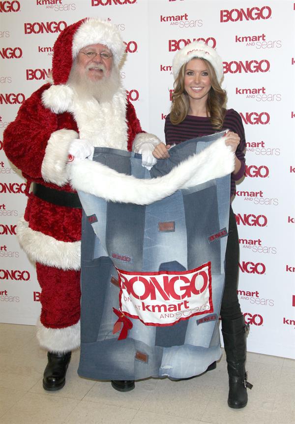 Audrina Patridge poses with Santa Claus