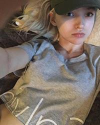 Dove Cameron taking a selfie
