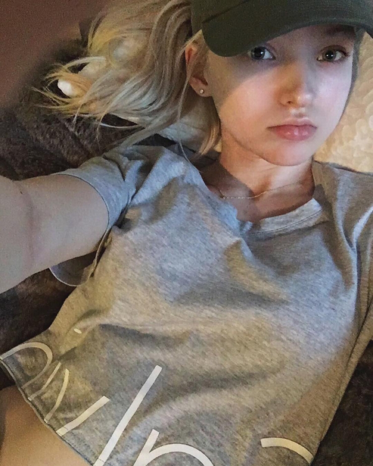 Dove Cameron taking a selfie