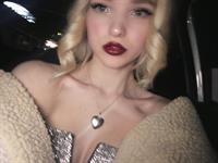 Dove Cameron taking a selfie