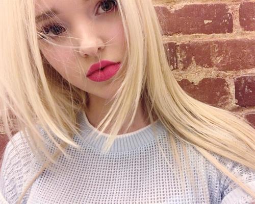 Dove Cameron taking a selfie