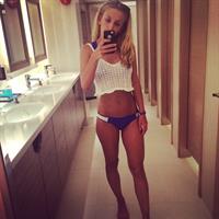 Tiffany Watson in a bikini taking a selfie