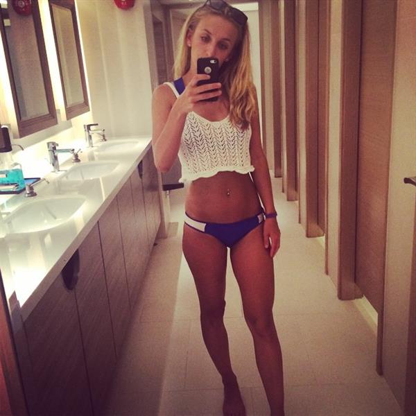 Tiffany Watson in a bikini taking a selfie