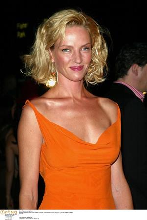Uma Thurman in an orange dress