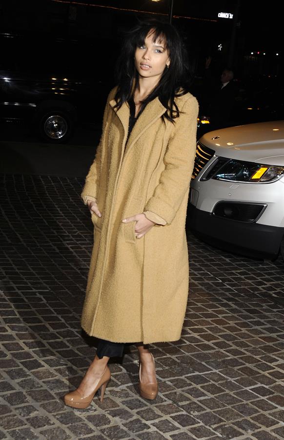Zoe Kravitz in a long jacket and high heels
