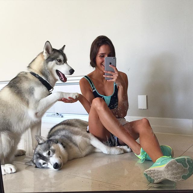 Kayla Itsines in a bikini taking a selfie