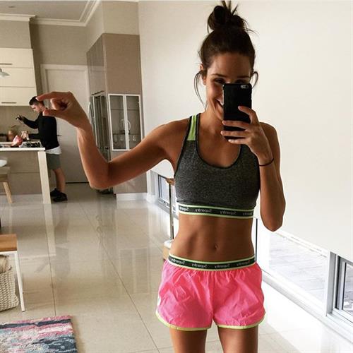 Kayla Itsines taking a selfie