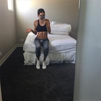 Kayla Itsines taking a selfie