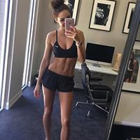 Kayla Itsines taking a selfie