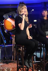 Taylor Swift performs at a private concert for NRJ on a barge on The Seine January 28, 2013 