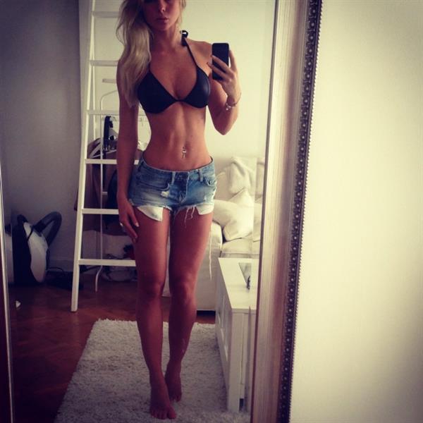 Alexandra Bring in a bikini taking a selfie