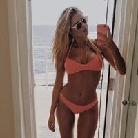 Kayla Rae Reid in a bikini taking a selfie