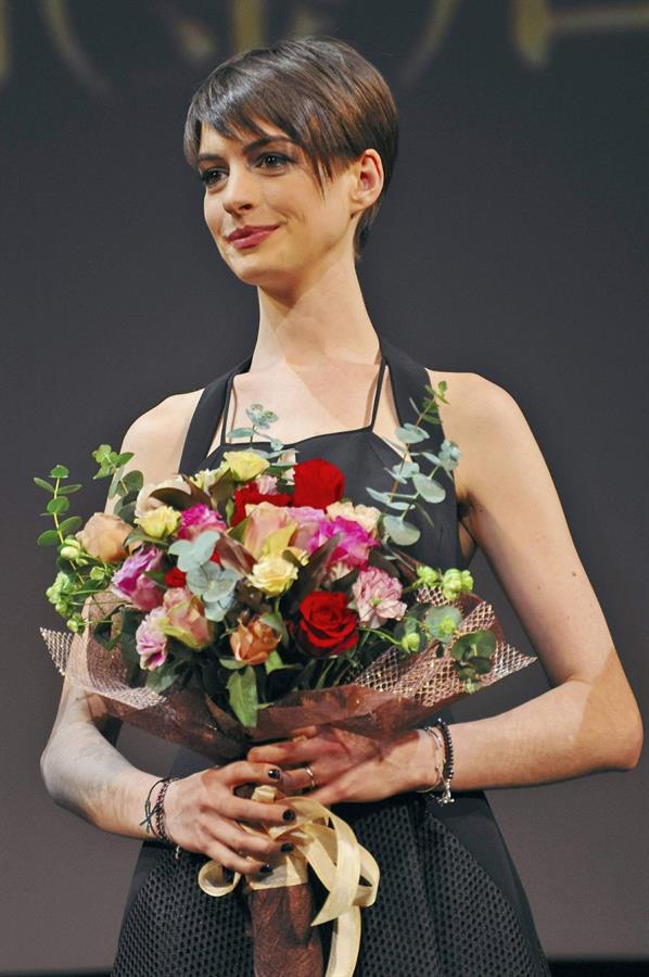 Anne Hathaway poses for photographers during an event to promote their latest movie 'Les Miserables' in Tokyo