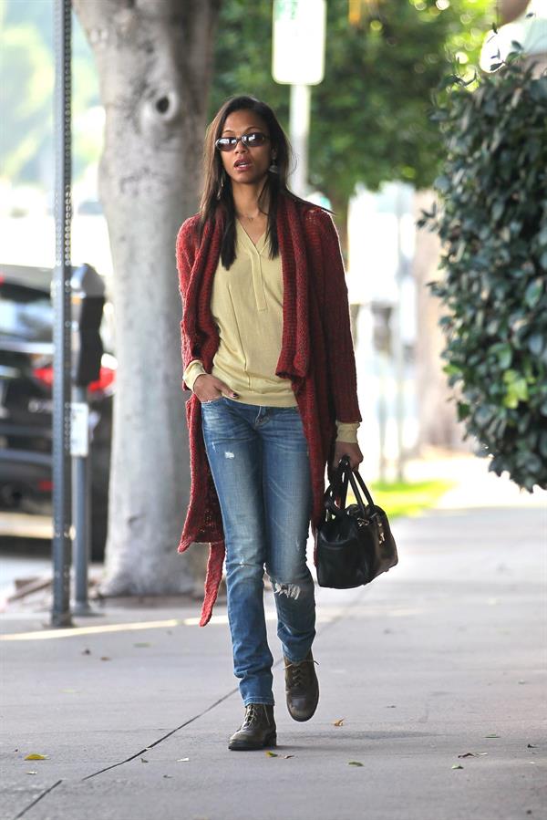 Zoe Saldana out and about in West Hollywood wearing a long red sweater coat January 19-2012 