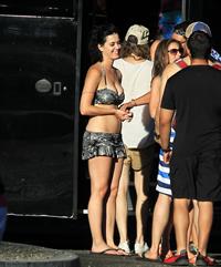 Katy Perry talks with a group of her friends after spending the afternoon at Raging Waters in San Dimas, California on August 12, 2012