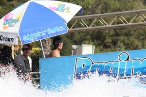 Katy Perry talks with a group of her friends after spending the afternoon at Raging Waters in San Dimas, California on August 12, 2012