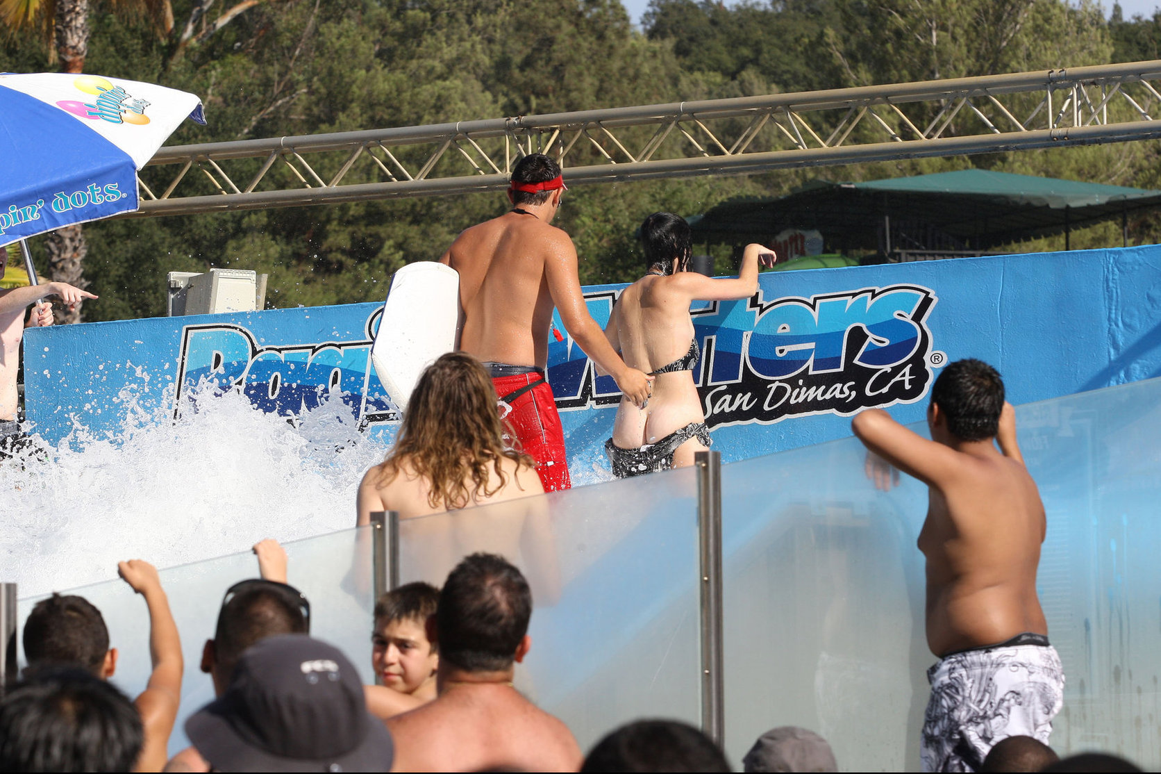 Katy Perry talks with a group of her friends after spending the afternoon at Raging Waters in San Dimas, California on August 12, 2012
