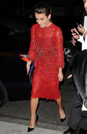 Lea Michele outside in a red dress at night