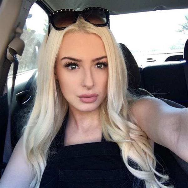 Tana Mongeau taking a selfie