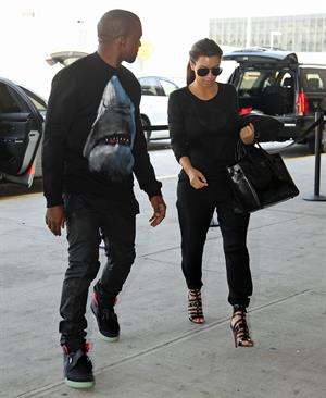 Kim Kardashian and Kanye West JFK airport in New York - 09 August 2012 