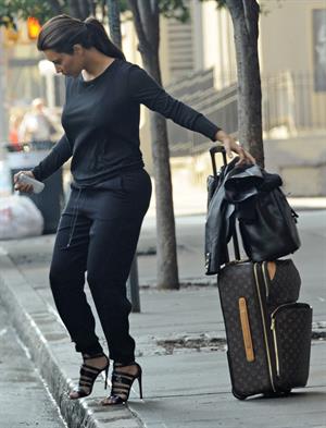 Kim Kardashian and Kanye West JFK airport in New York - 09 August 2012 