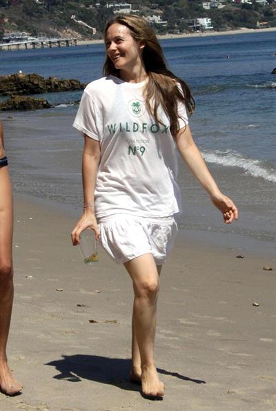 Alicia Silverstone walking on the beach in Malibu 