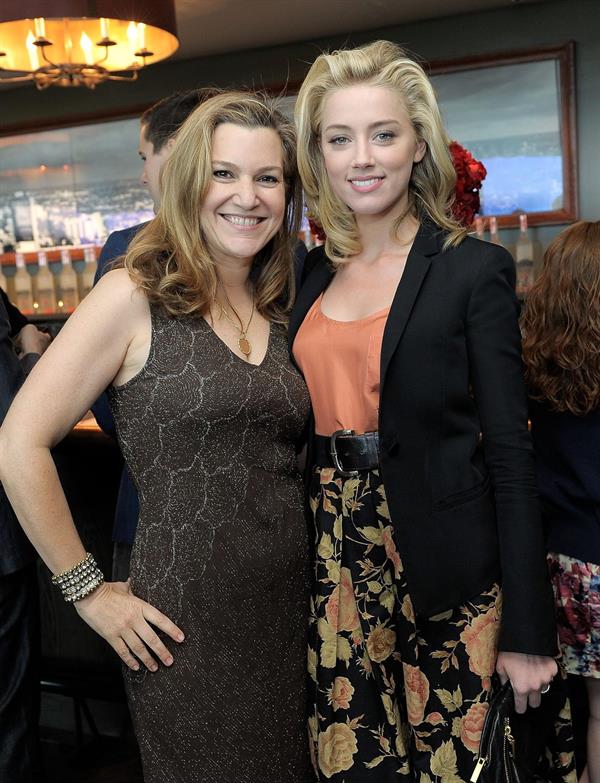 Amber Heard Belvedere Vodka and Krista Smith toast Vanity Fair's June 2011 Vanities in West Hollywood on May 14, 2011