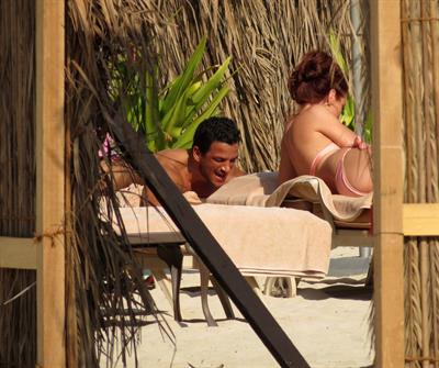 Amy Childs sunbathing with Peter Andre in Dubai on January 3, 2012
