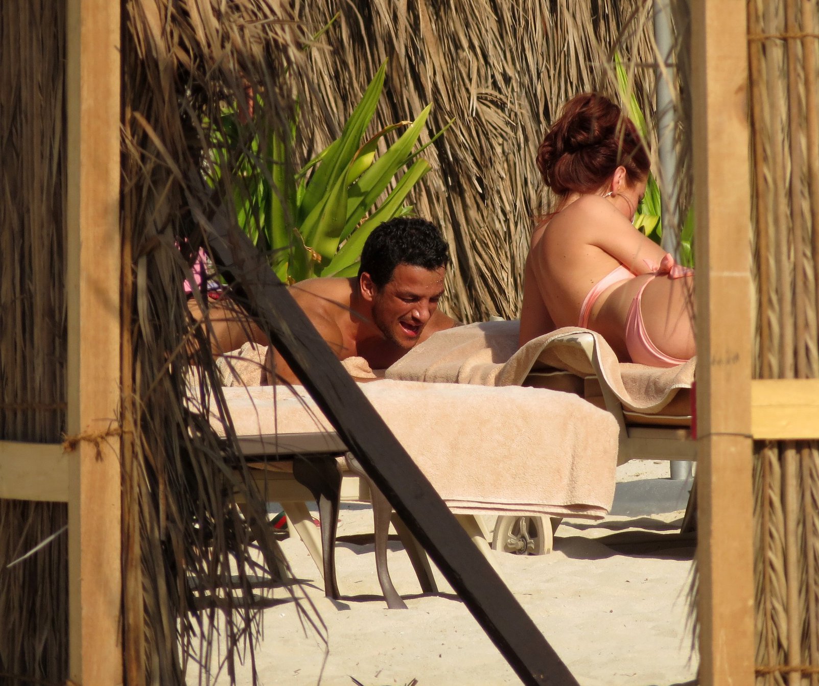 Amy Childs sunbathing with Peter Andre in Dubai on January 3, 2012