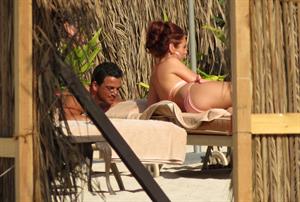 Amy Childs sunbathing with Peter Andre in Dubai on January 3, 2012