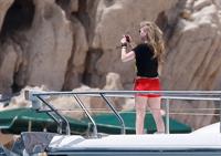 Avril Lavigne in a green bikini in Cabo, Mexico on July 27, 2012