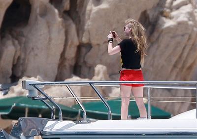 Avril Lavigne in a green bikini in Cabo, Mexico on July 27, 2012