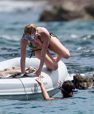 Avril Lavigne in a green bikini in Cabo, Mexico on July 27, 2012